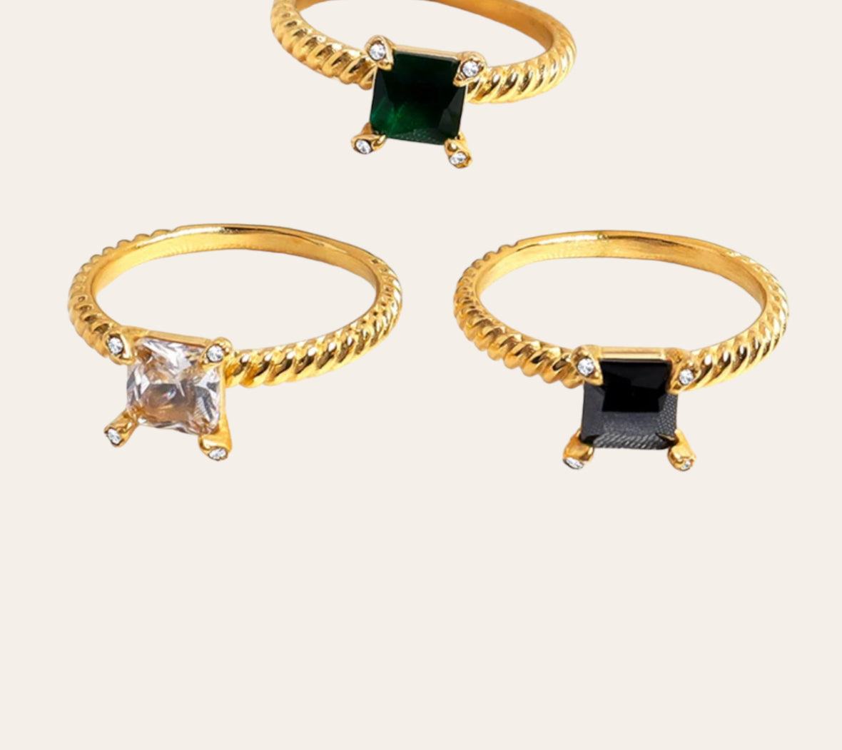 Allure Ring trio with black, green and clear zircon on ribbed gold band