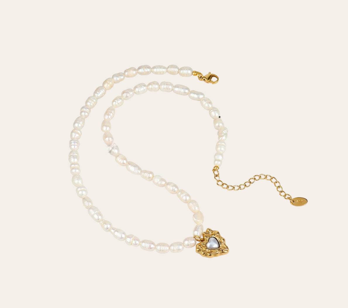 Beaded Heart Necklace with imitation pearls and gold-plated 316L heart charm, plain background