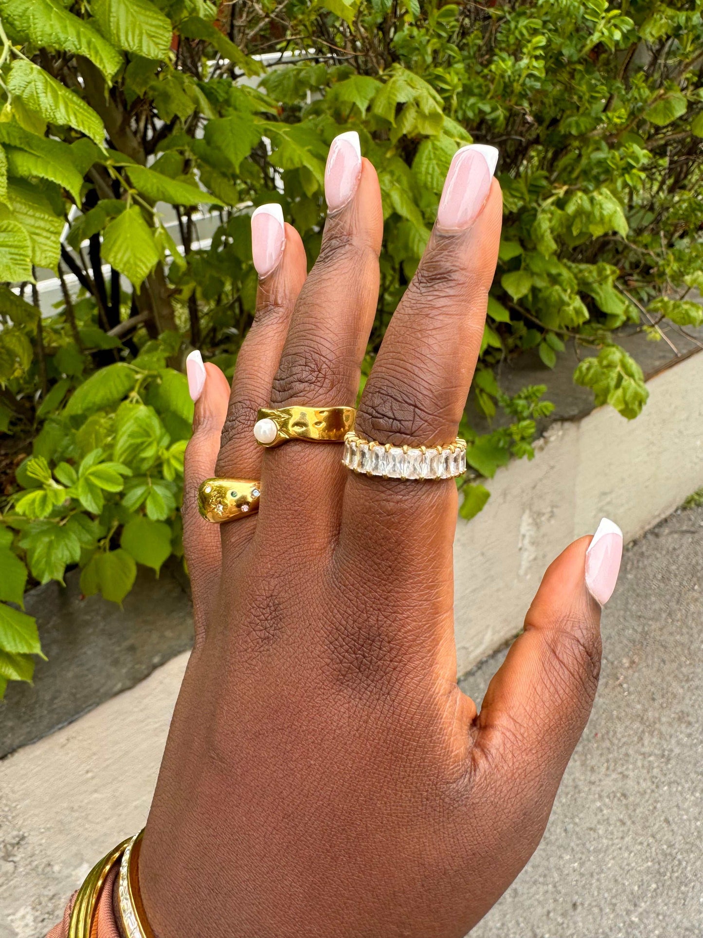 Model close-up wearing the Prism Ring, baguette zircon eternity band