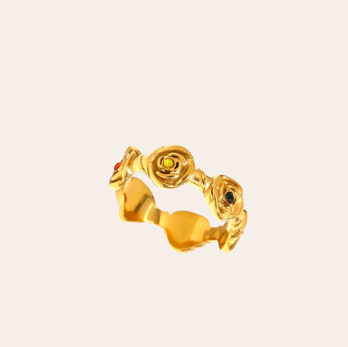 Rose Ring with sculpted rose motifs and multicolor zircon stones on plain background