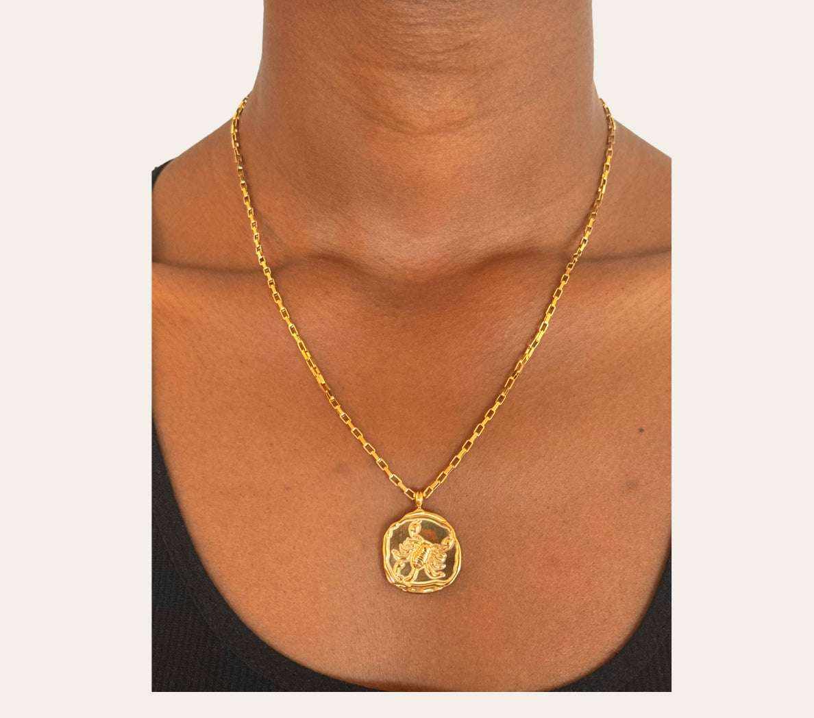 Model wearing the Scorpio Zodiac Necklace in 18k gold-plated stainless steel, waterproof hypoallergenic astrology jewelry