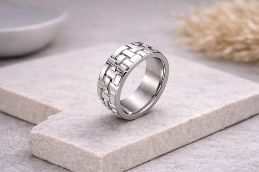 stainless steel band showing woven surface detail and polished finish