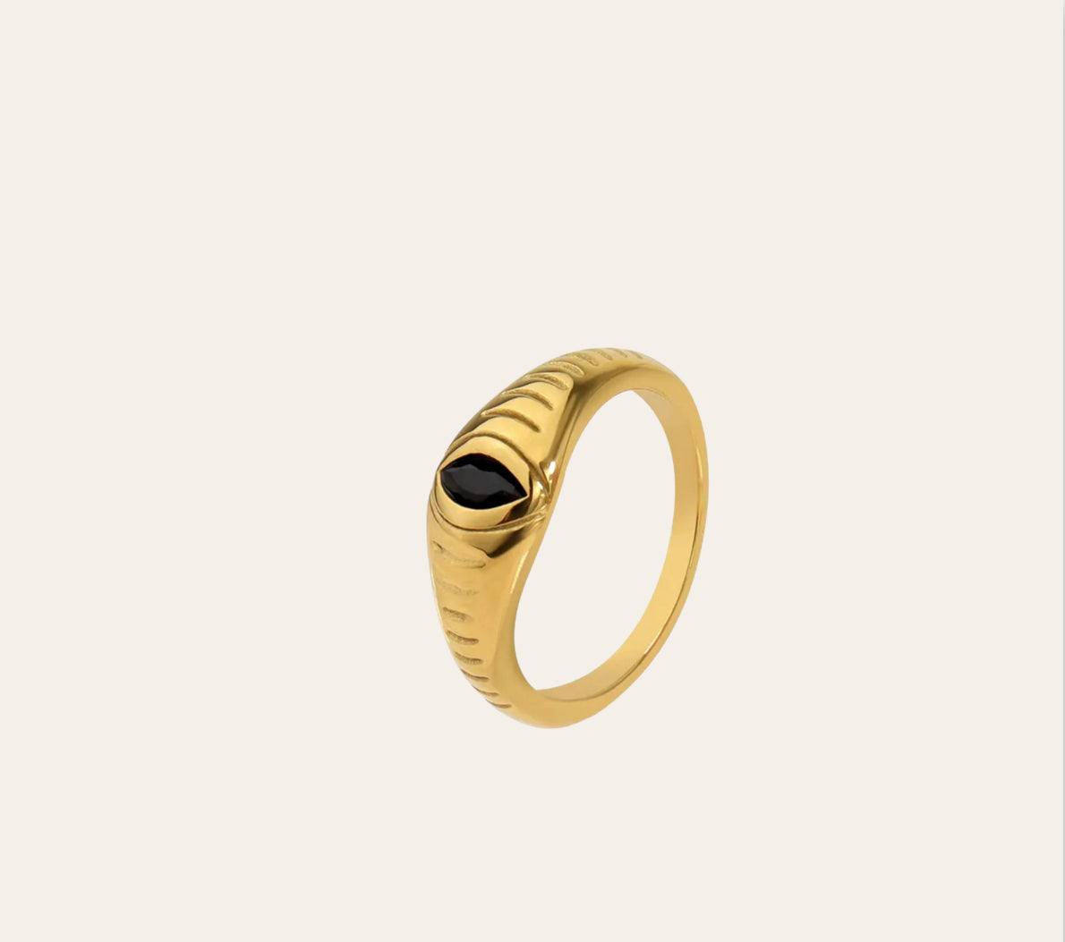 Alexandra Ring, gold-plated ridged signet band with marquise black zircon on plain background