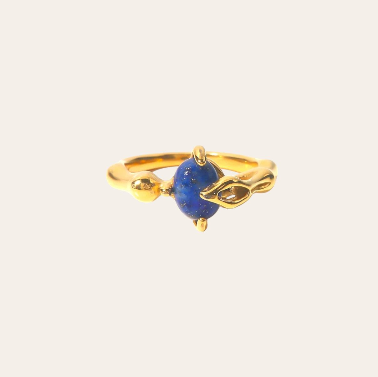 Azure Orb Ring, gold-plated band with deep-blue cabochon on plain background.