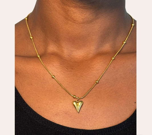 Blossom Heart Necklace styled on model, delicate everyday heart necklace