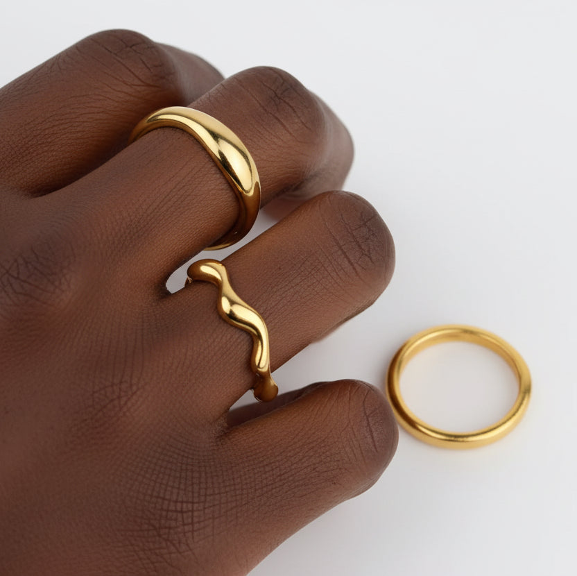 Model wearing the Cloe Ring minimal organic wave band stacked on hands