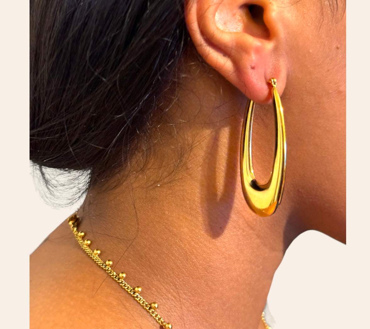 Contour U-Drop Earrings on model sculpted glossy open drop