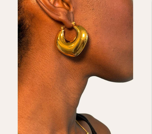 Crescent Dome Hoops on model  glossy crescent dome (18k gold-plated stainless steel), 40 mm width