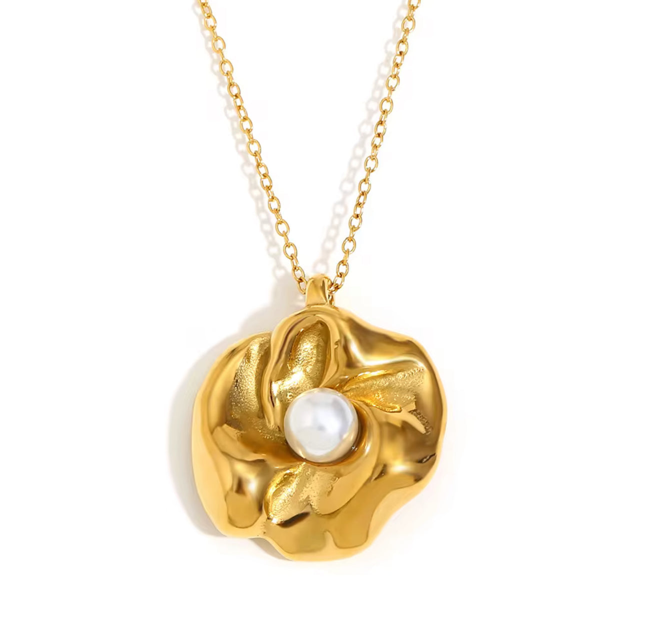 Gold floral pearl necklace featuring a polished flower-shaped pendant with a white pearl centerpiece.