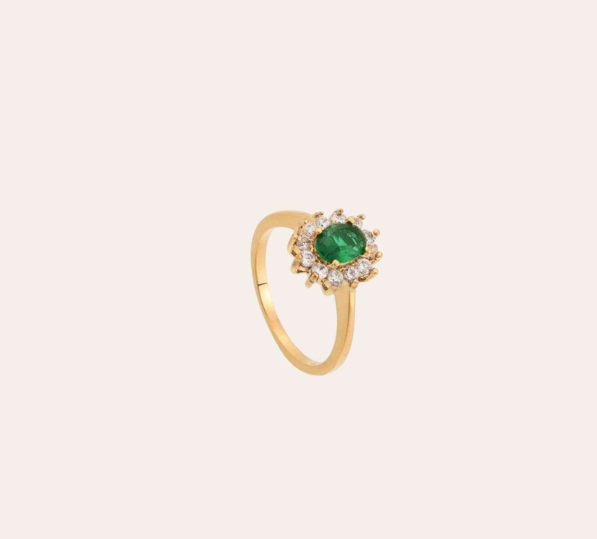 Flower Ring, gold-plated band with green oval zircon and clear zircon halo on plain background