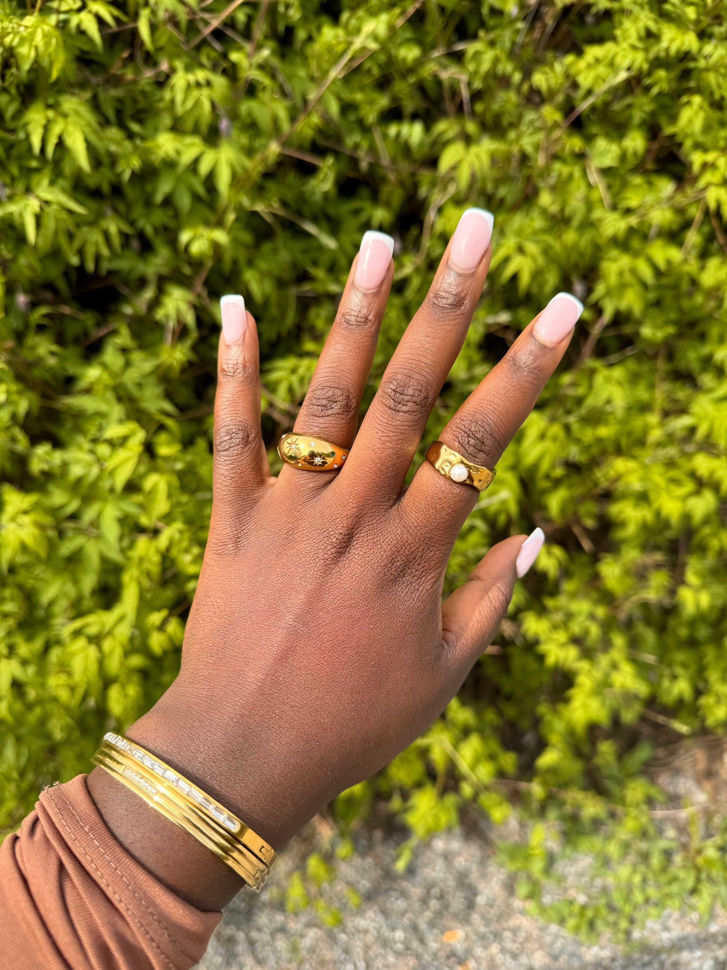 Galaxy Ring styled with other pieces on the model’s hand for a stacked look