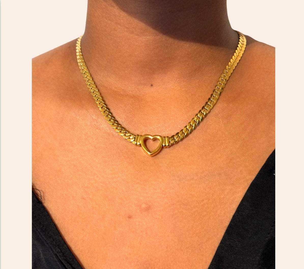 Heart Chain Necklace in 18k gold-plated 316L worn at the collarbone, heart centerpiece
