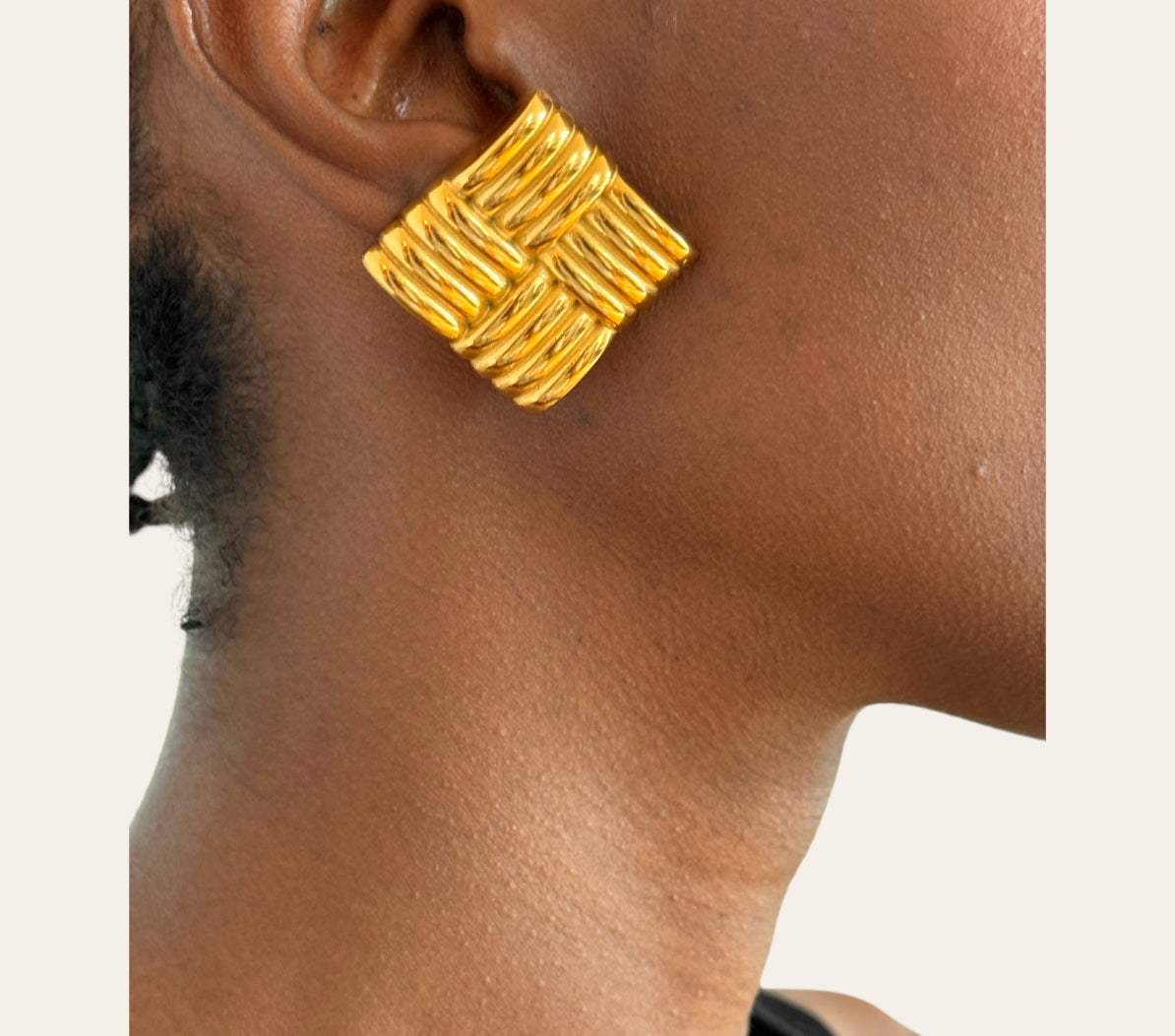 Jade Earrings on model  ribbed square studs (18k gold-plated)