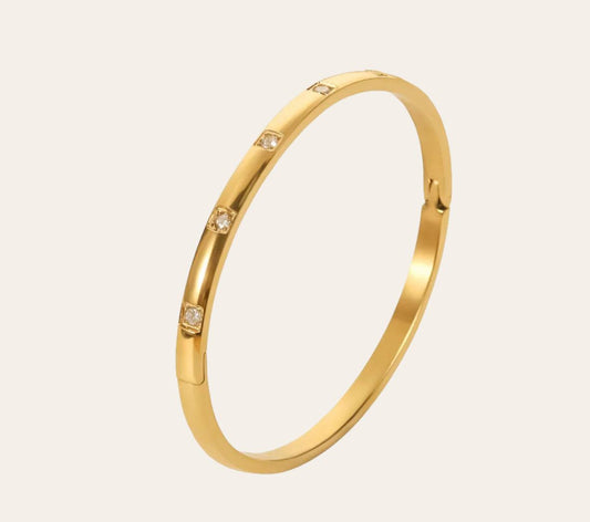 Lumière Bangle in 18k gold-plated stainless steel (316L), polished sleek design, waterproof tarnish-free hypoallergenic jewelry
