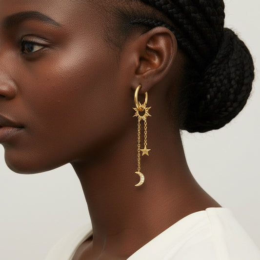 Gold hoop earrings with sun charm and dangling star and moon charms