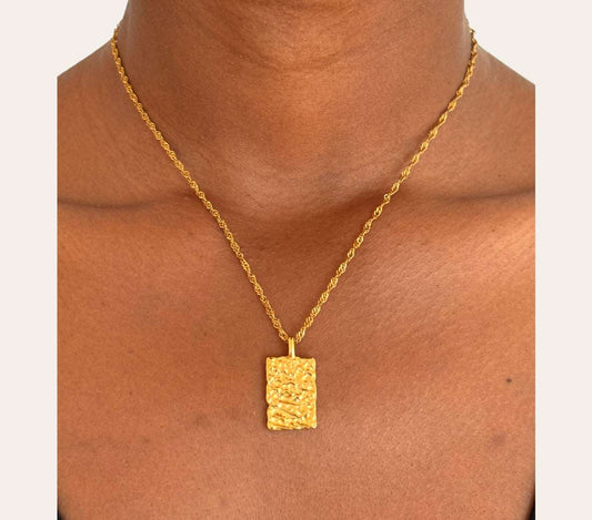 Poise Rectangle Necklace worn on model, sculptural hammered rectangle pendant