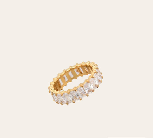 Prism Ring—18k gold-plated band with baguette-cut clear zircon on plain background