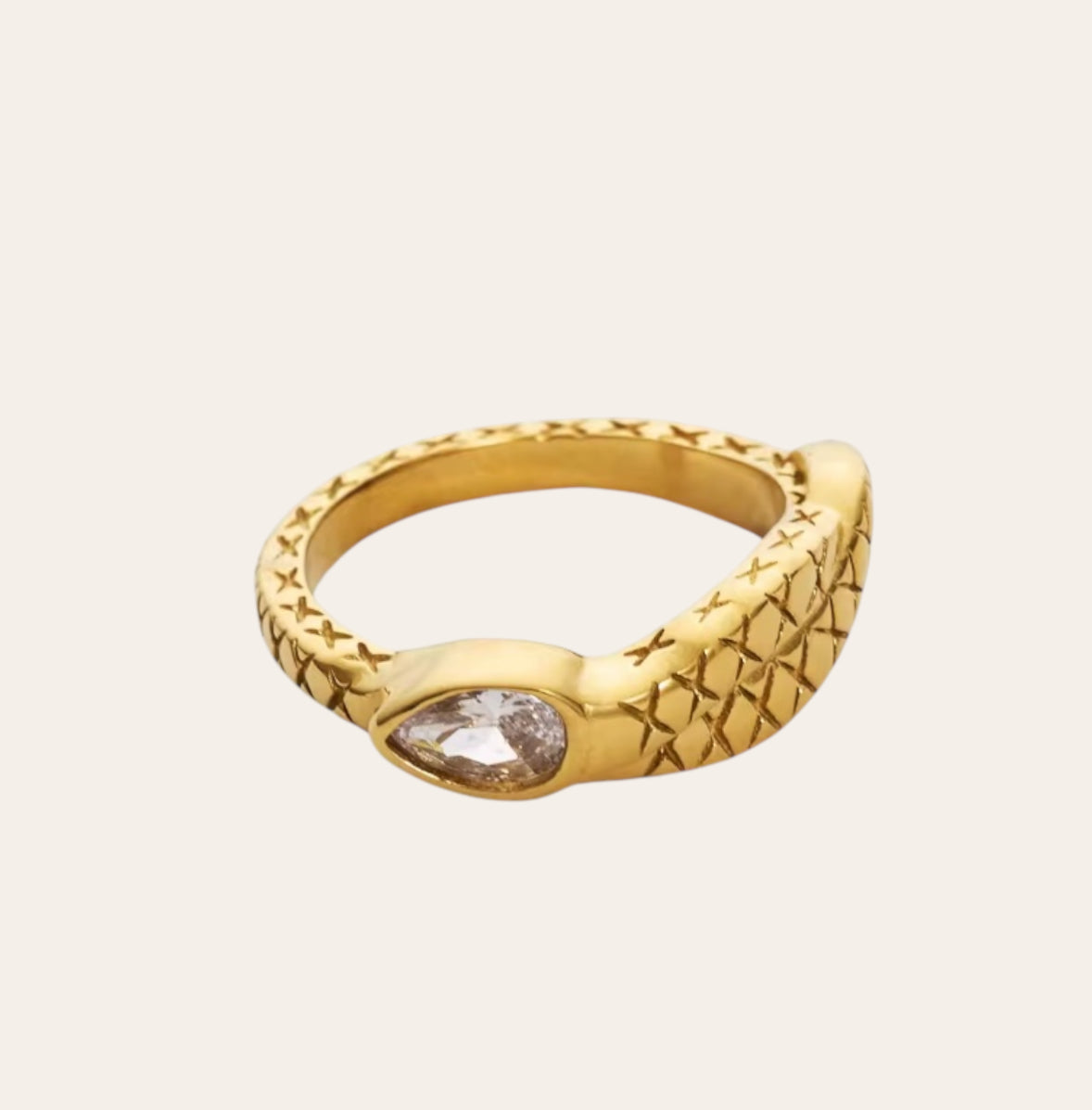 Snake Ring in 18k gold-plated stainless steel with clear zircon on plain background.