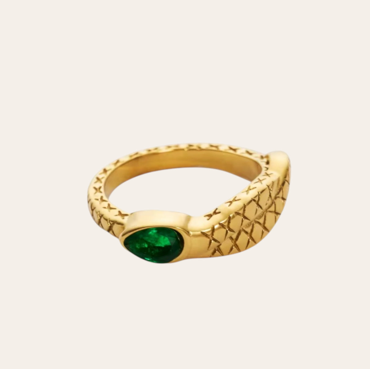 Snake Ring in 18k gold-plated stainless steel with green zircon on plain background.
