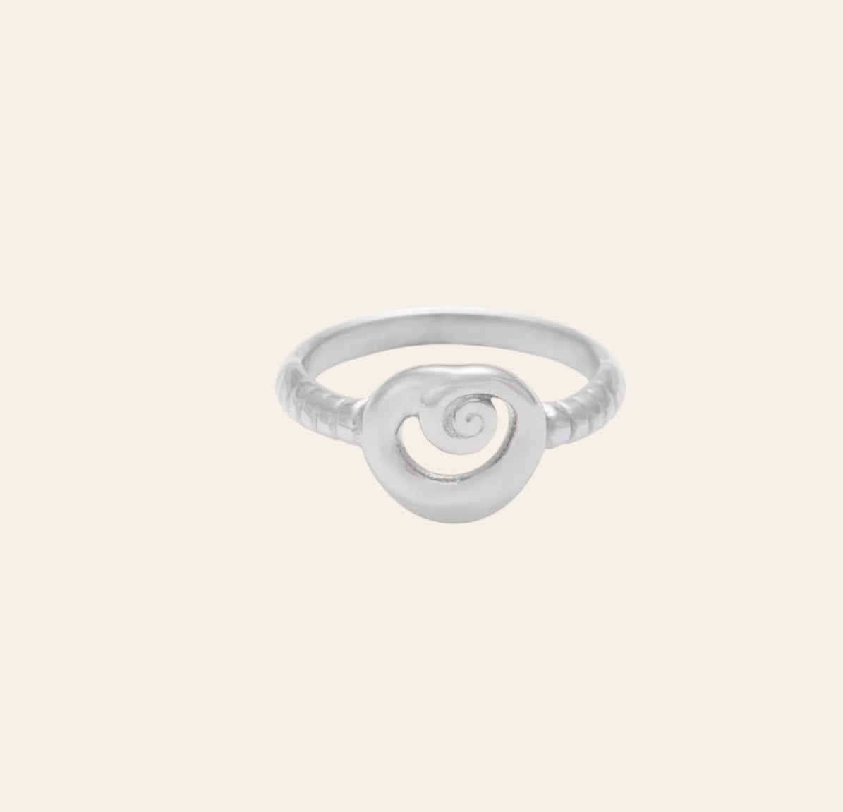 Spira Ring in polished 316L stainless steel with spiral centerpiece on plain background