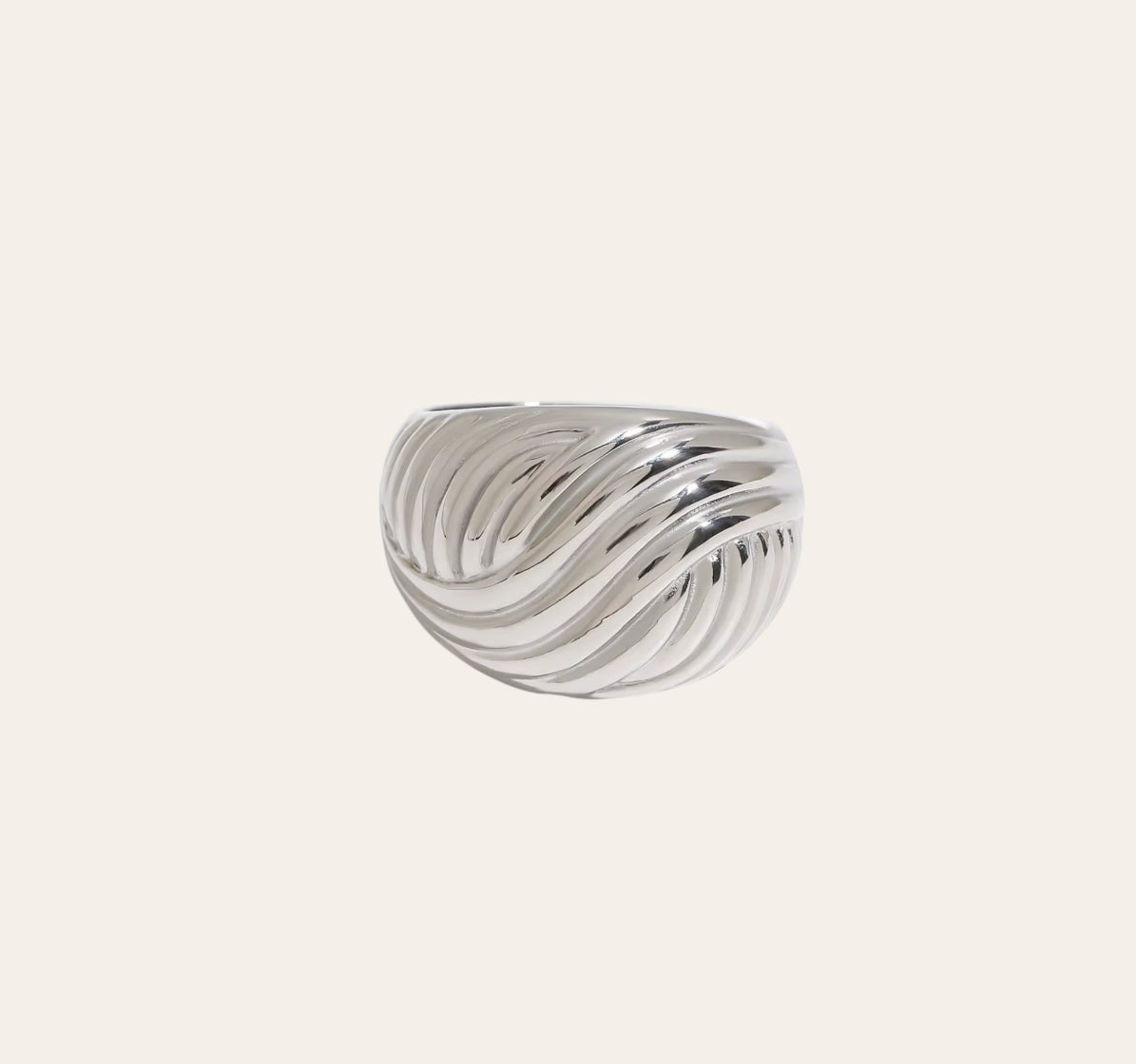 Swirl Ring sculpted dome band with flowing grooves in 316L stainless steel on plain background