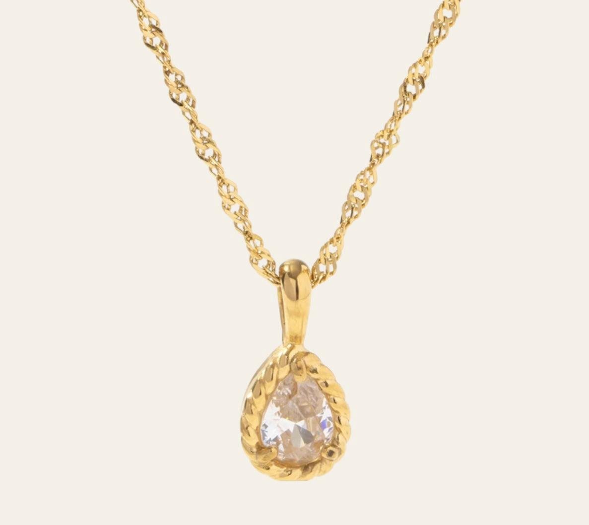 Zara Necklace with pear-cut clear zircon in a twisted rope bezel on plain background